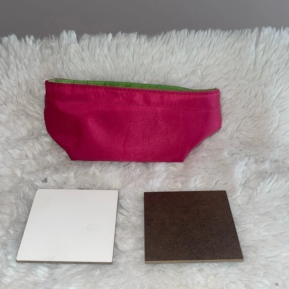 Pencil bag and 2 sample painting boards with Velcro stickers on the back .